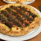 Foto do prato da pizza de maniçoba-